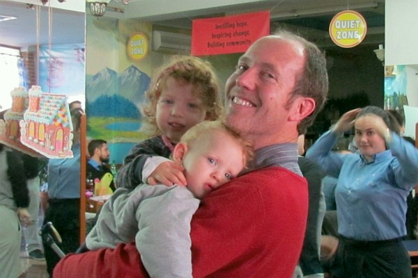 Robert Cook, teacher and pastor, with his children