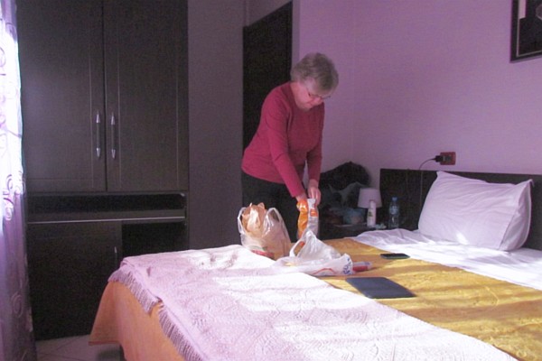 Elsie in ur hotel room unpacking some food we bought 