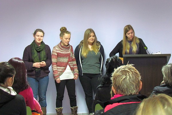 volunteers from England share a song