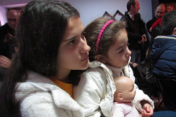 Evianda and her neice listen during the worship service
