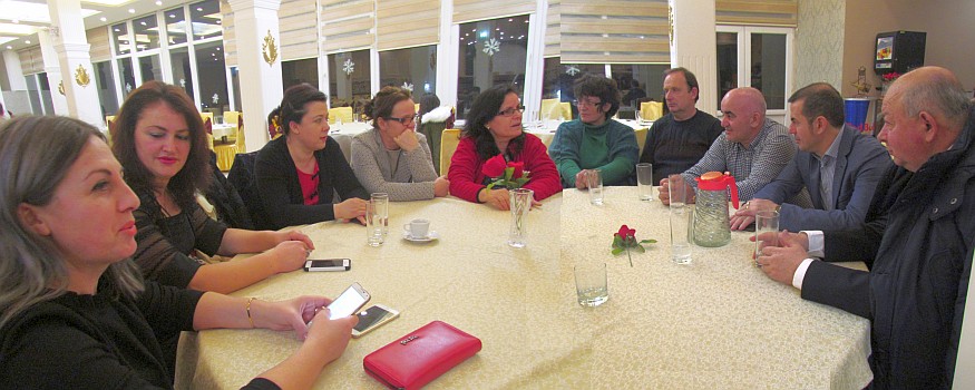 a merged photo of a group around a table