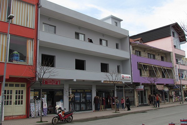 another building with two floors occupied and one not