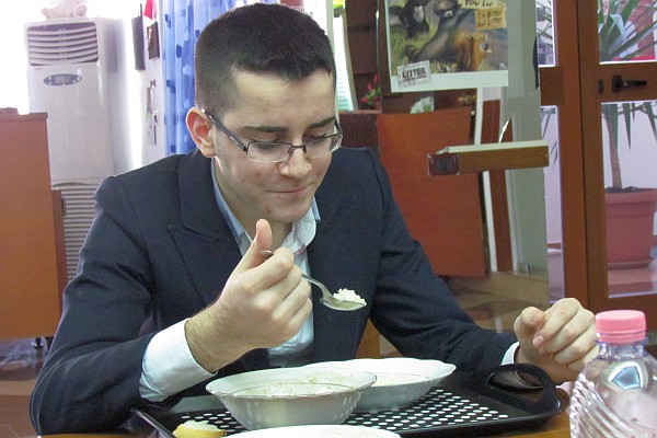 a student easts in the cafeteria