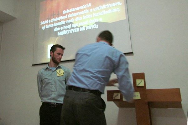 Pastor Rafael makes a visual point about Jesus taking our sins to the cross