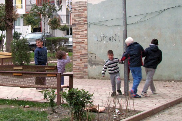 boys of the neighborhood gather in the same park as the girls