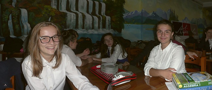 Twp students sit inn the cafeteria and talk with me during a blackout