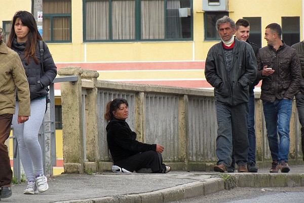 a woman begging for money