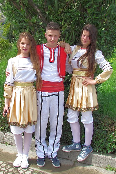 one set of colorful outfits for boys and girls from one village