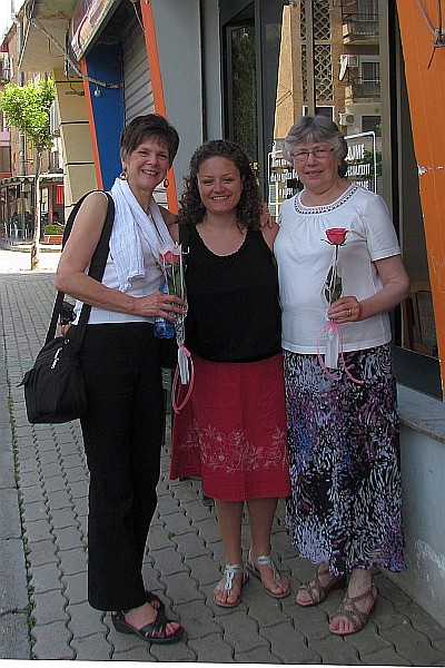 Lisa gave the two mothers a flower for Mothers Day