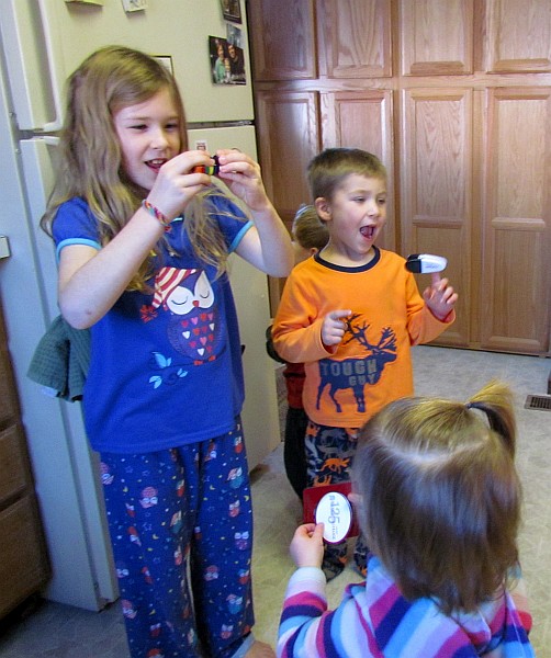 three of our grandchildren at play in our kitchen