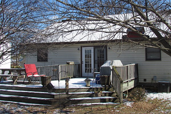 the back of our home in Harrisonburg with snow