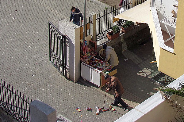 a shop keeper cleans up afdter the children have snacked