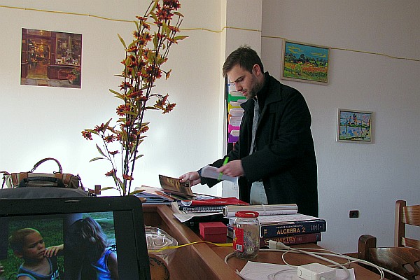 in the teacher's room Justin prepares for his next class