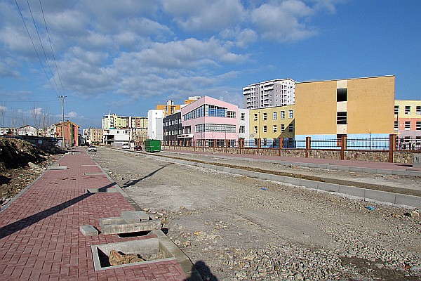 a new street is being made near some new apartment buidings