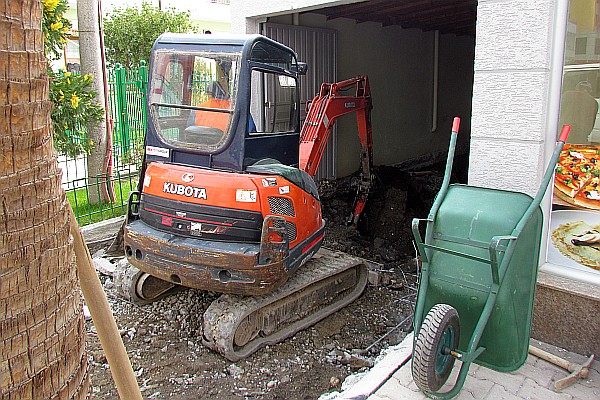 small Kubota backhoe at work