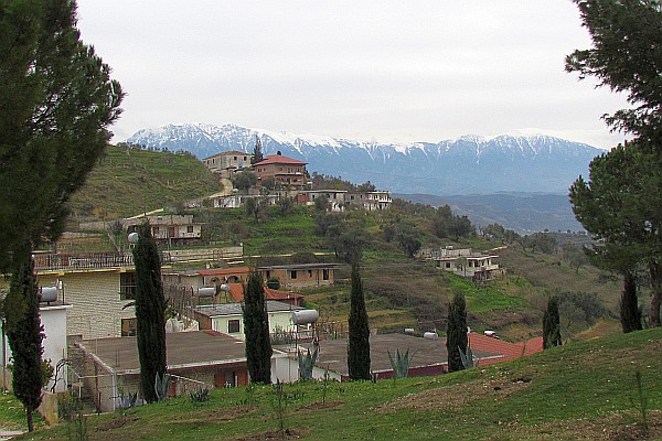 looking out at the hillside and mountinas beyond