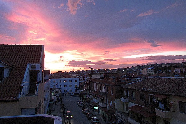 a pink-tinged sky at sunset from our balcony