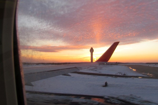 ready for takeoff with a beautiful sunset and traffice control toower