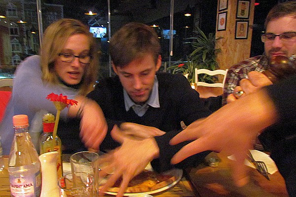 Josh thinks he has to protect his pizza or he will nave none left