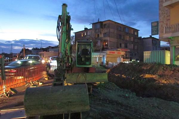 one of the main streets is being torn up as dusk set in