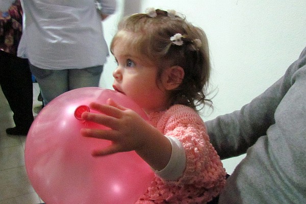 Sophia, the birthday girl, in her Dad's lap