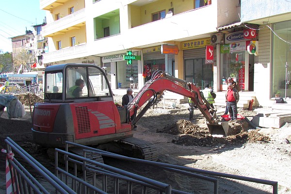 a backhoe at work on one of the street in Lezhe