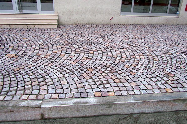 the replaced sidewalk has a very interesting arc design