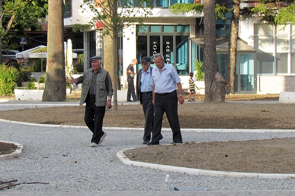 senior men walk and discuss life