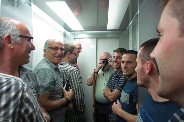 a mirrored photo in the elevator to Jolly's Restaurant