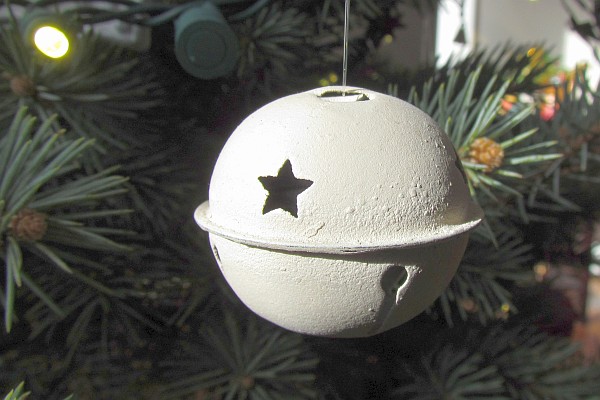 a white Christmas tree bell ornamanet