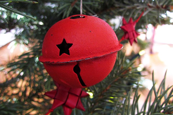 a red Christmas tree bell ornamanet