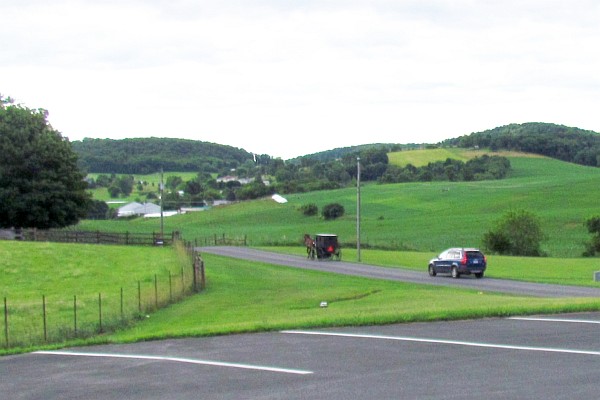 Old OIrder Mennonite horse and buggy followed by a car