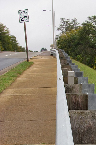 guard rail along a sidewalk (I)