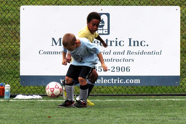 grandson Nathan prepares to kick the ball