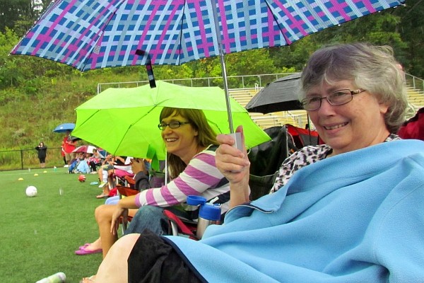 mother and grandmother watch the games