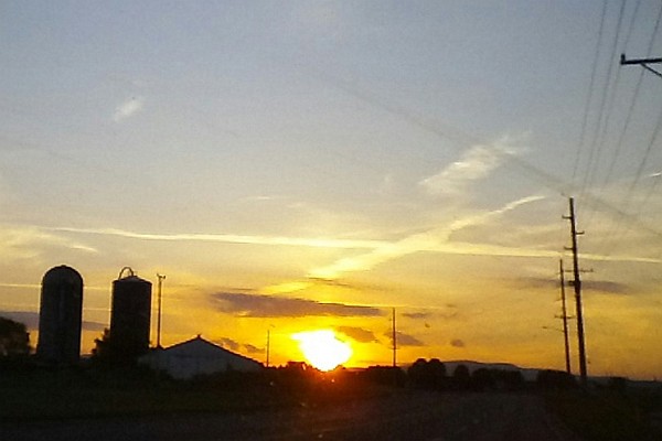 sun sets over Mt. Clinton Pike going toward Route 42