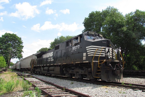 NS 9577 connected to some grain cars