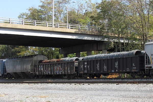 low gondolas filled with coiled steel