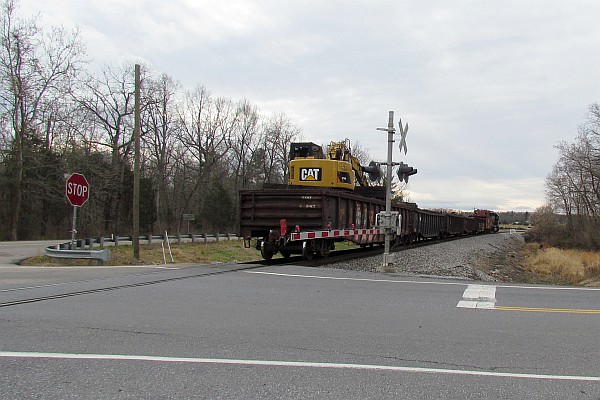 low open gondola car probably with rail ties in it